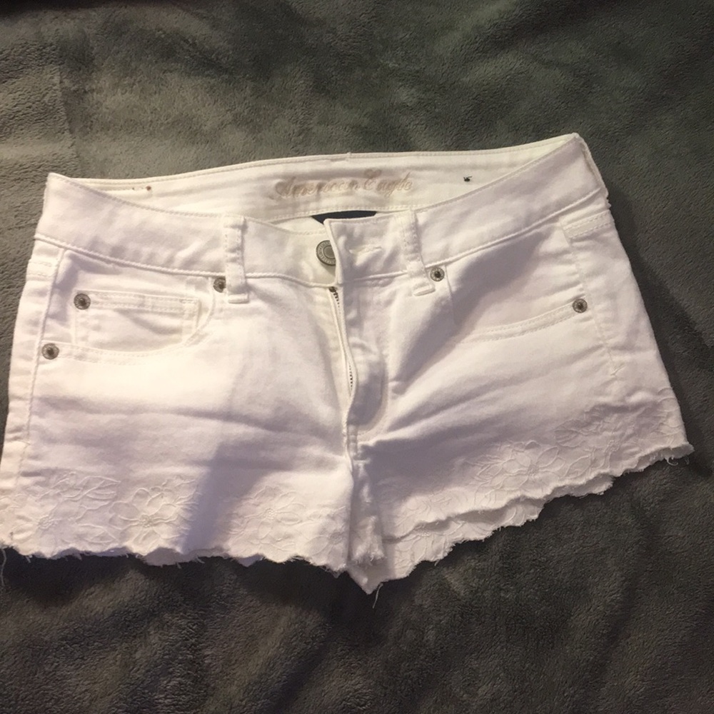 Tiny blue stain on back right pocket.